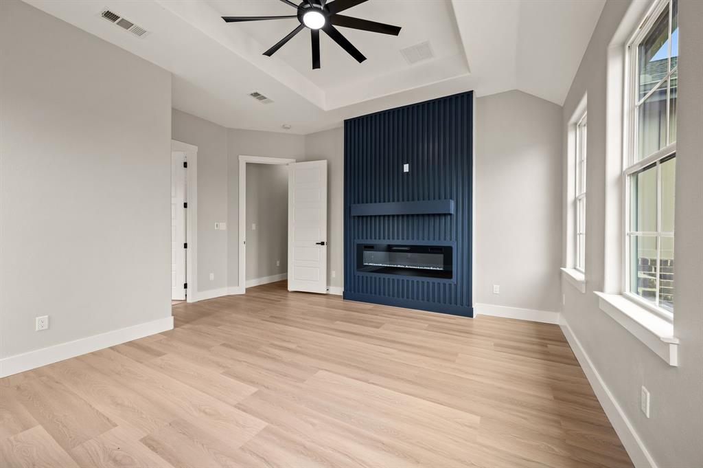 806 N Avenue East Springtown, TX 76082 - Photo 14 of 25 a view of an empty room with a window and kitchen view