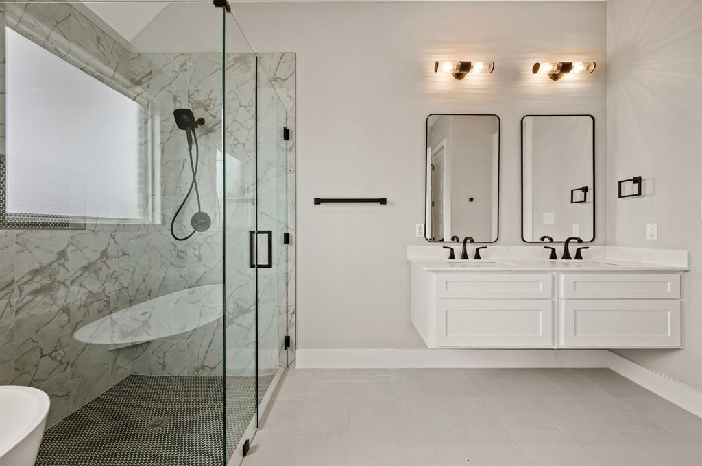 806 N Avenue East Springtown, TX 76082 - Photo 16 of 25 a bathroom with a double vanity sink mirror and shower