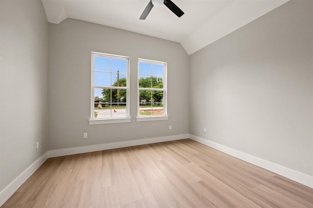 806 N Avenue East Springtown, TX 76082 - Photo 18 of 25 wooden floor in an empty room with a window