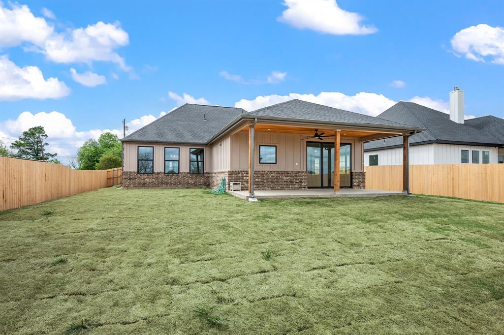 806 N Avenue East Springtown, TX 76082 - Photo 23 of 25 a front view of a house with a garden