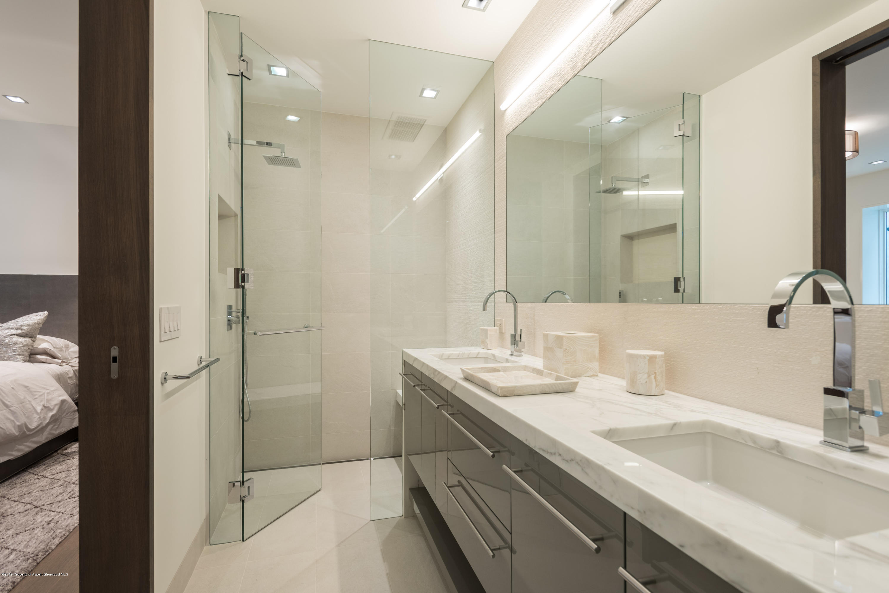 79 Winter Way Aspen, CO 81611 - Photo 18 of 40 a bathroom with a double vanity sink mirror and shower