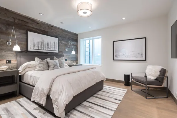 a bedroom with bed and a window