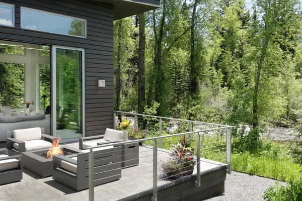 a view of a patio with couches chairs and potted plants