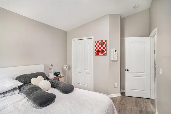 a bedroom with a bed and cabinets