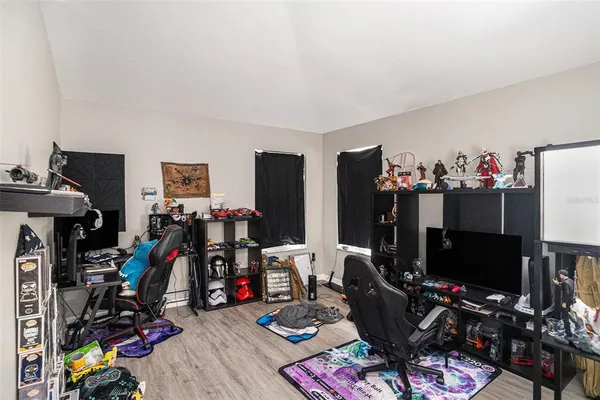 a room with furniture and a flat screen tv