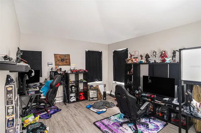 a room with furniture and a flat screen tv