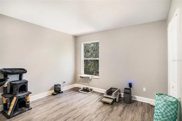 a view of a room with workspace and a window