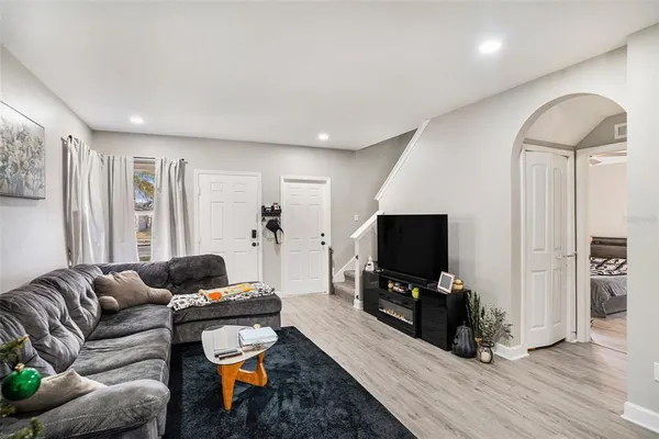 a living room with furniture and a flat screen tv