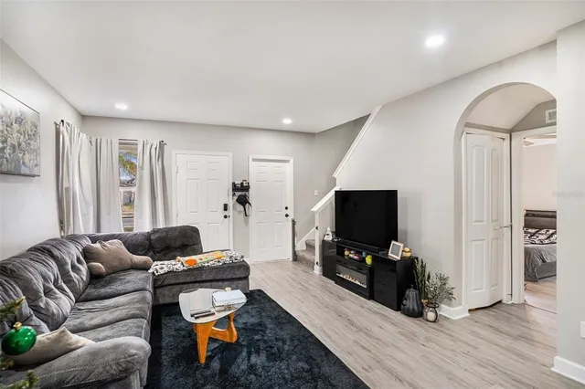 a living room with furniture and a flat screen tv