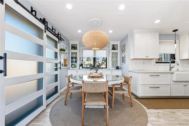 a kitchen with stainless steel appliances granite countertop a stove and a sink