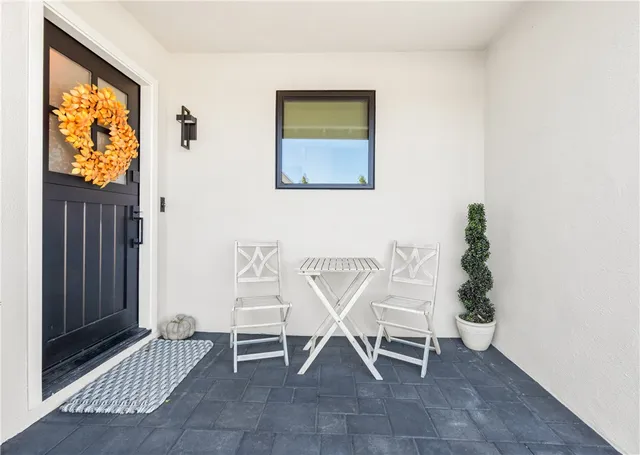 a dining room with furniture and a window