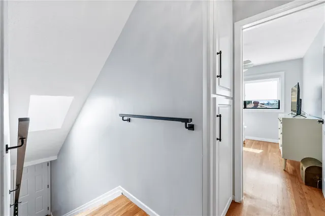 a bedroom with a bed and a ceiling fan