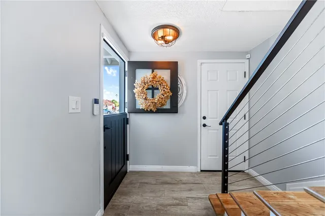a living room with furniture large window and a fireplace