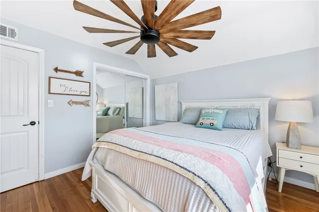 a bedroom with a bed and a desk