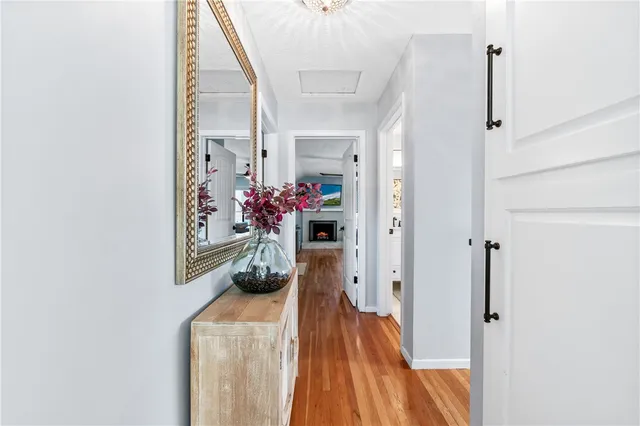 a spacious bedroom with a bed and a fireplace