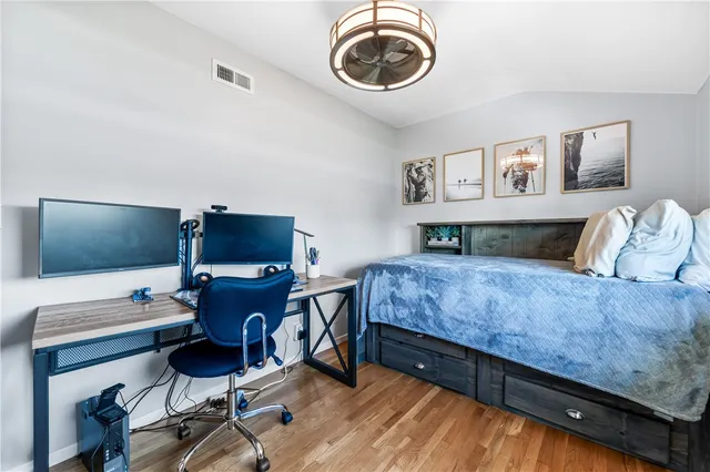 a view of a patio with table and chairs and potted plants