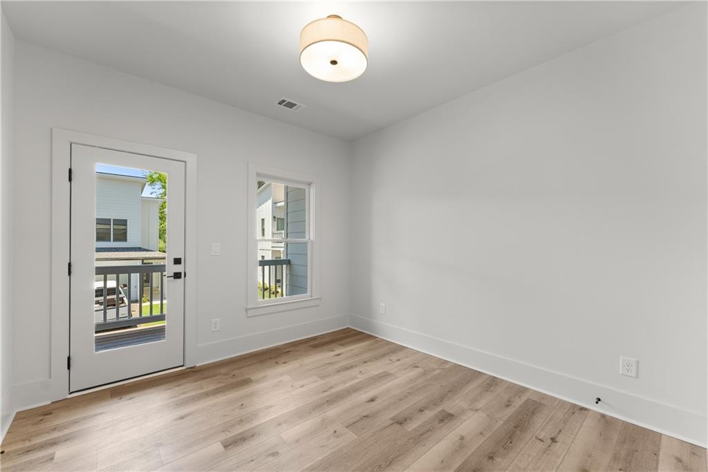 380 Forrest Avenue Gainesville, GA 30501 - Photo 25 of 31 an empty room with windows and entrance