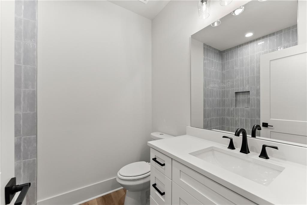 380 Forrest Avenue Gainesville, GA 30501 - Photo 30 of 31 a bathroom with a sink and a toilet