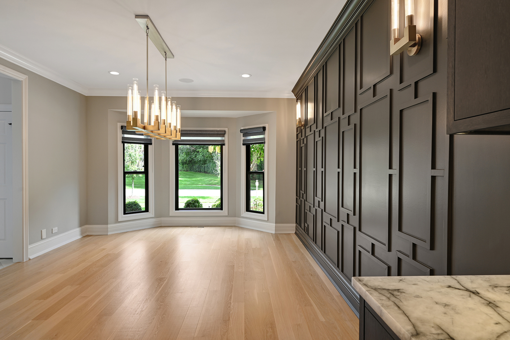 1813 Kelly Court Darien, IL 60561 - Photo 17 of 56 a view of hallway with chandelier and wooden floor