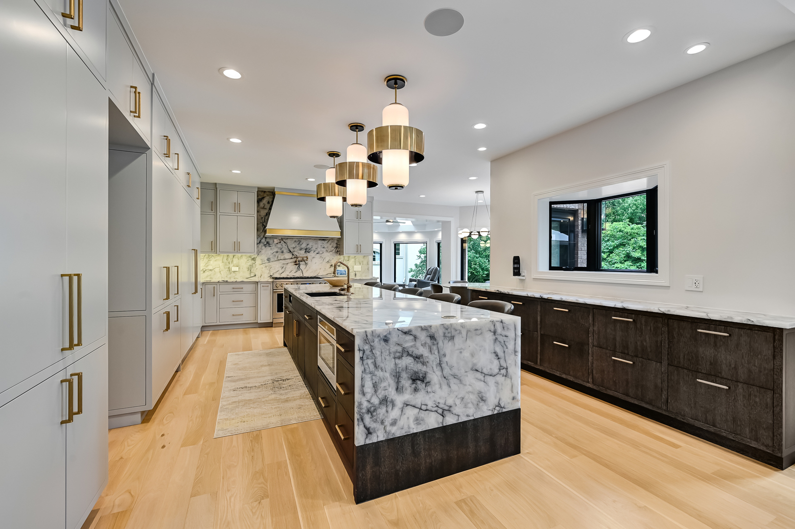 1813 Kelly Court Darien, IL 60561 - Photo 18 of 56 a large kitchen with kitchen island granite countertop a large counter top and stainless steel appliances