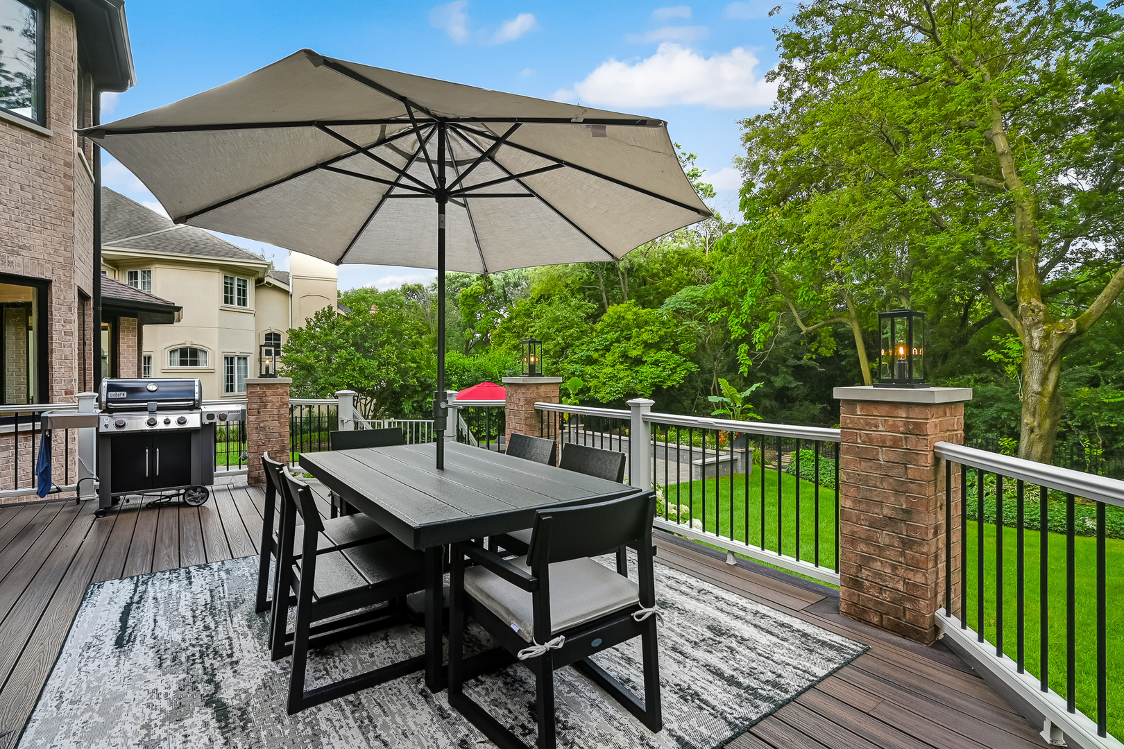 1813 Kelly Court Darien, IL 60561 - Photo 23 of 56 a patio with wooden floor a yard a table and chairs