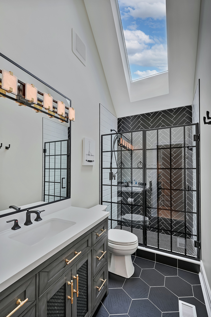 1813 Kelly Court Darien, IL 60561 - Photo 43 of 56 a bathroom with a sink toilet and shower