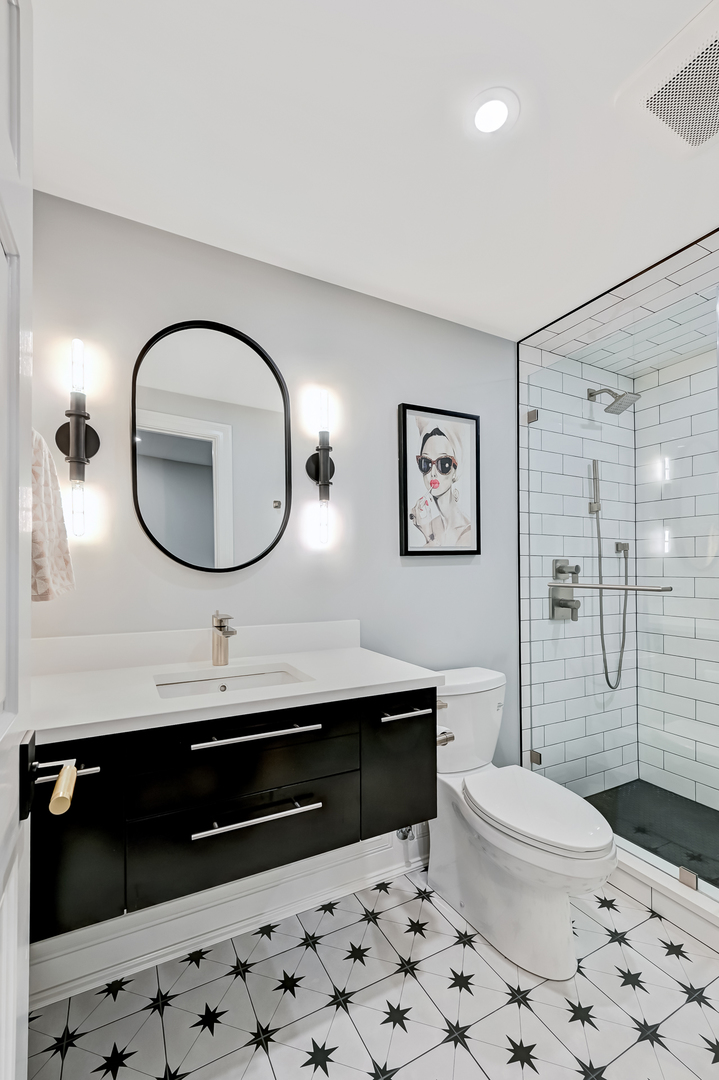 1813 Kelly Court Darien, IL 60561 - Photo 46 of 56 a bathroom with a toilet a sink and a mirror