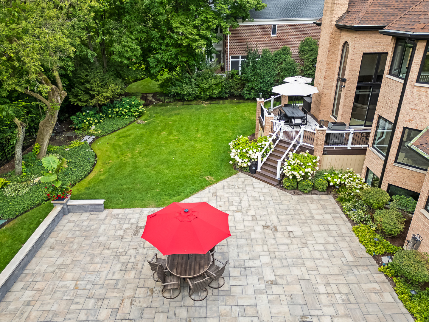 1813 Kelly Court Darien, IL 60561 - Photo 5 of 56 a view of a patio with table and chairs potted plants with wooden floor