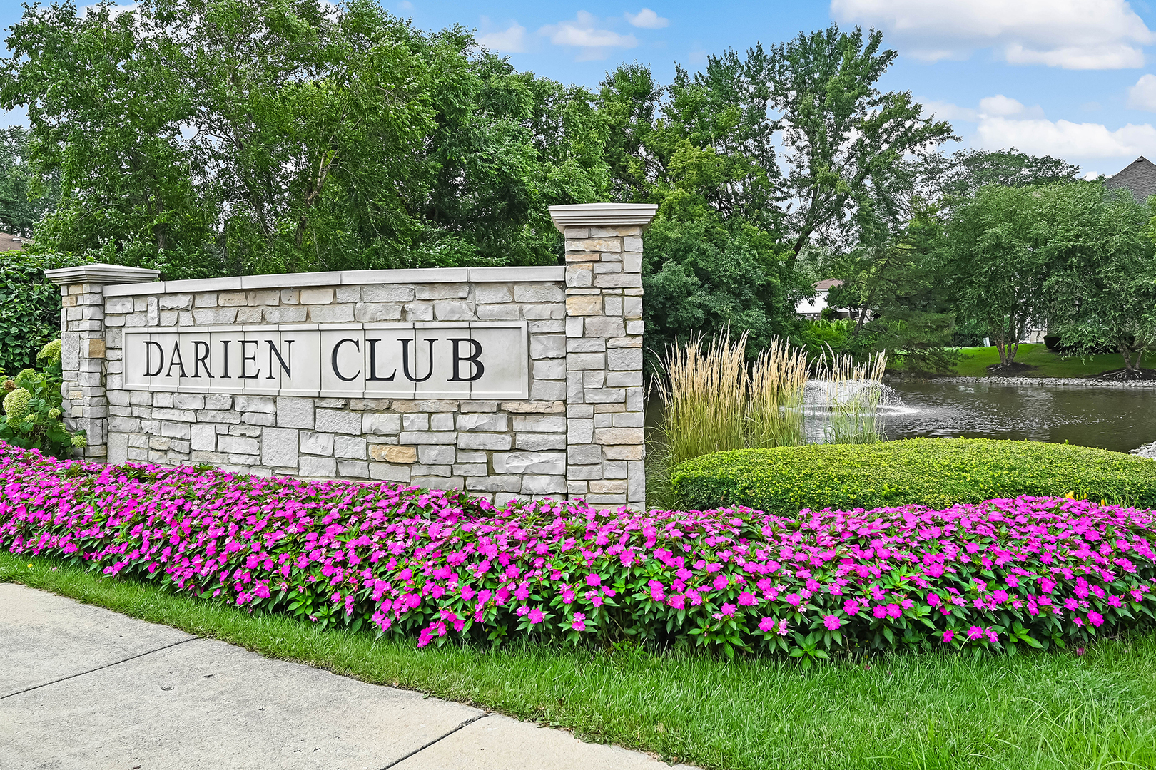 1813 Kelly Court Darien, IL 60561 - Photo 55 of 56 a sign that is in front of flowers