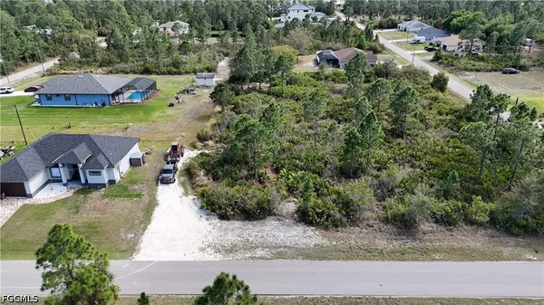 an aerial view of a house with outdoor space