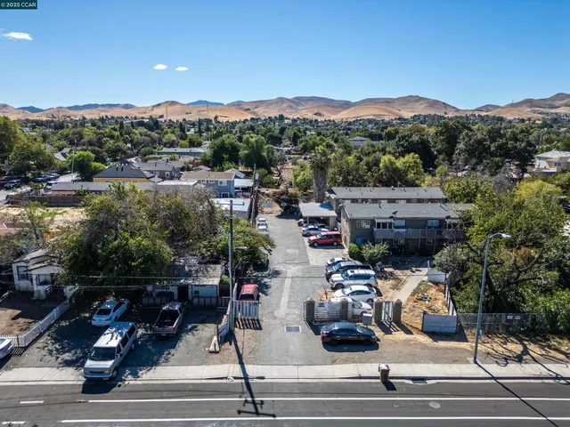 an aerial view of residential houses and city view