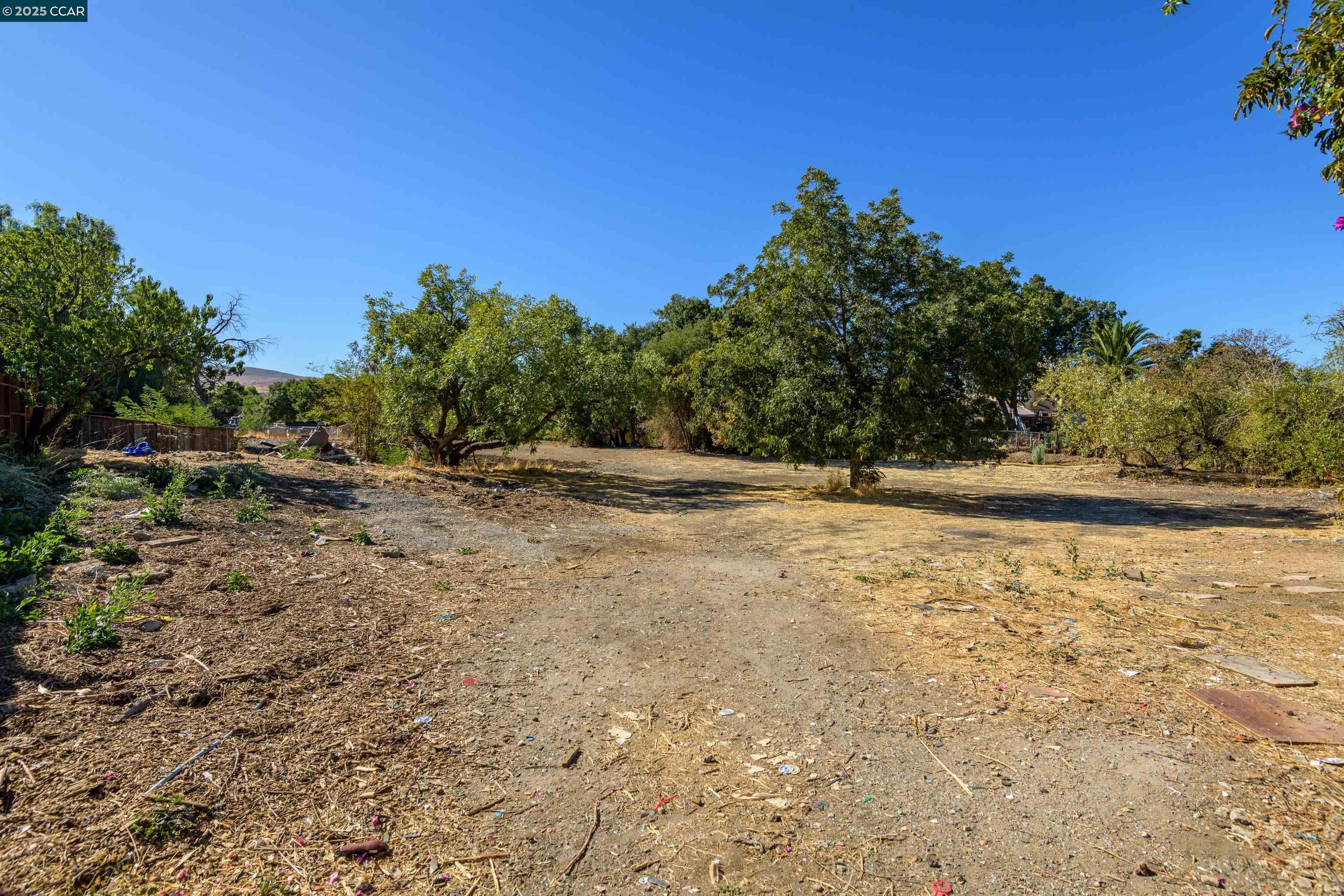 0 Mountain View Avenue Bay Point, CA 94565 - Photo 6 of 7 a backyard of a house with lots of green space