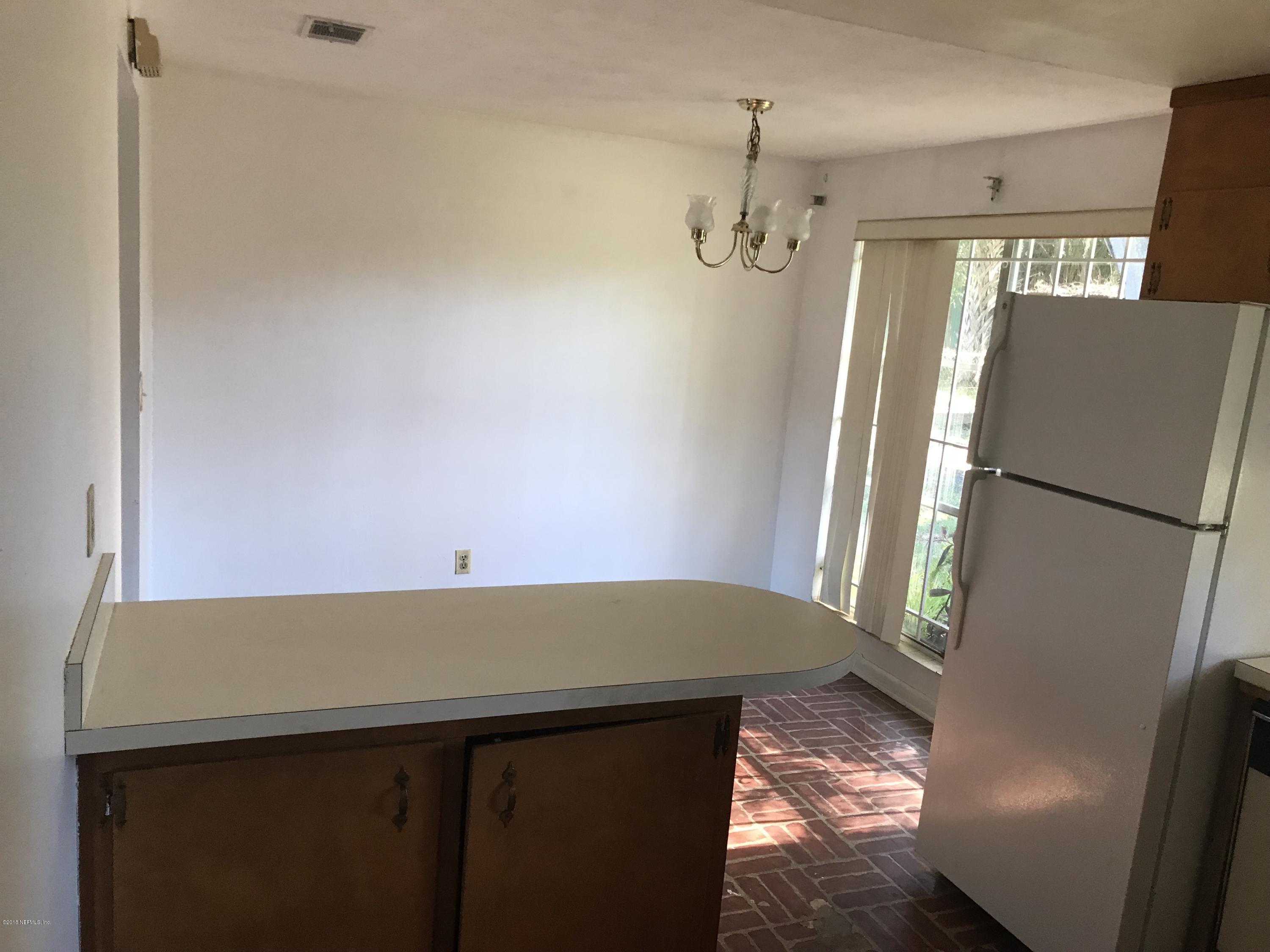 1032 Player Road Jacksonville, FL 32218 - Photo 3 of 12 a view of a room with furniture and a window
