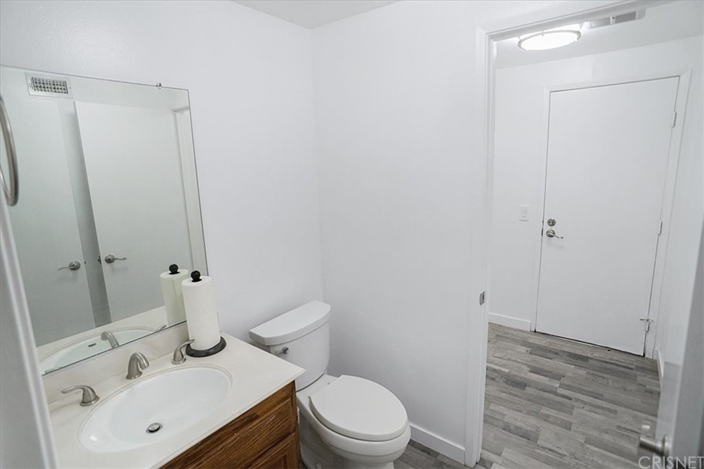 12230 Stewarton Drive Porter Ranch, CA 91326 - Photo 12 of 25 a bathroom with a sink a toilet and shower