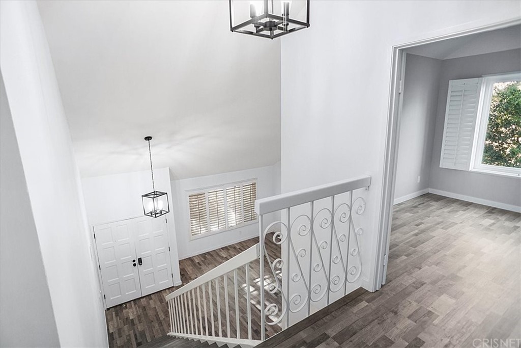 12230 Stewarton Drive Porter Ranch, CA 91326 - Photo 13 of 25 a view of an entryway with wooden floor