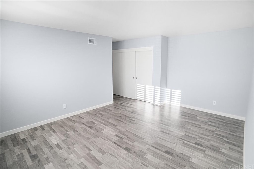 12230 Stewarton Drive Porter Ranch, CA 91326 - Photo 17 of 25 a view of wooden floor and brick walls
