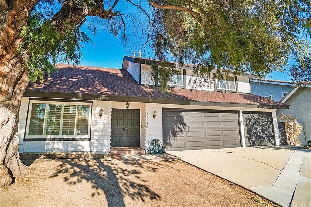12230 Stewarton Drive Porter Ranch, CA 91326 - Photo 2 of 25 a view of a house with a patio