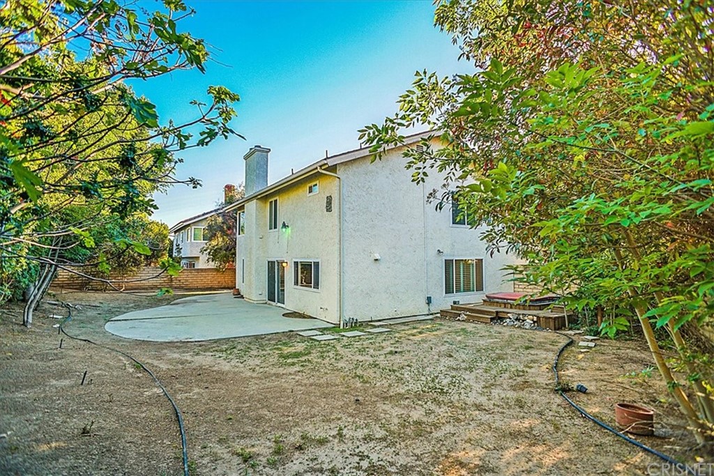 12230 Stewarton Drive Porter Ranch, CA 91326 - Photo 22 of 25 a view of a house with a yard