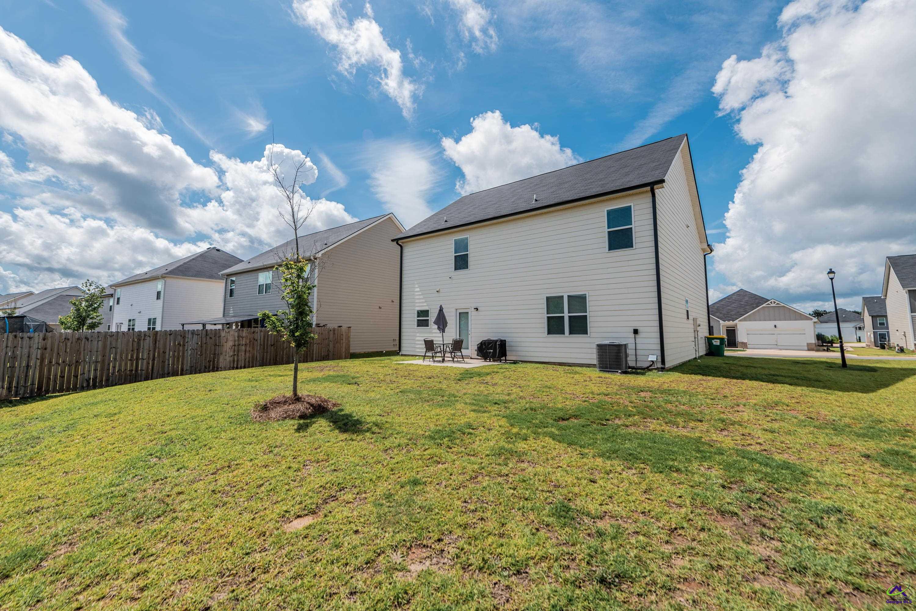 126 Farmers Way Perry, GA 31069 - Photo 36 of 39 a swimming pool with yard and outdoor seating