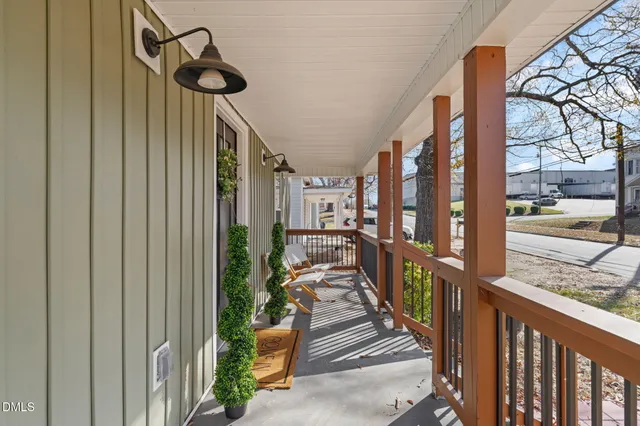 a view of a porch with wooden floor and stairs