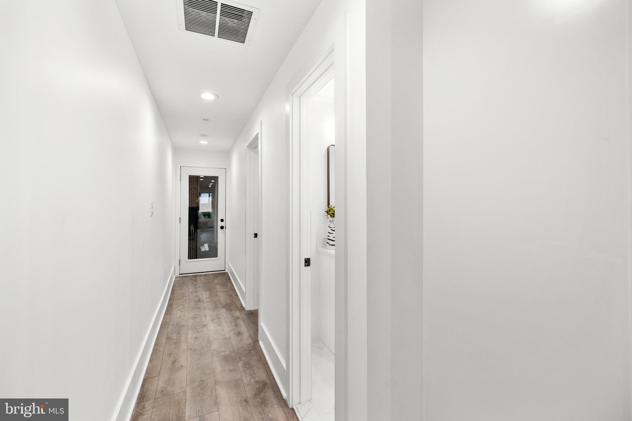113 18th Street Southeast, Unit 1 Washington, DC 20003 - Photo 11 of 37 a view of a hallway with wooden floor