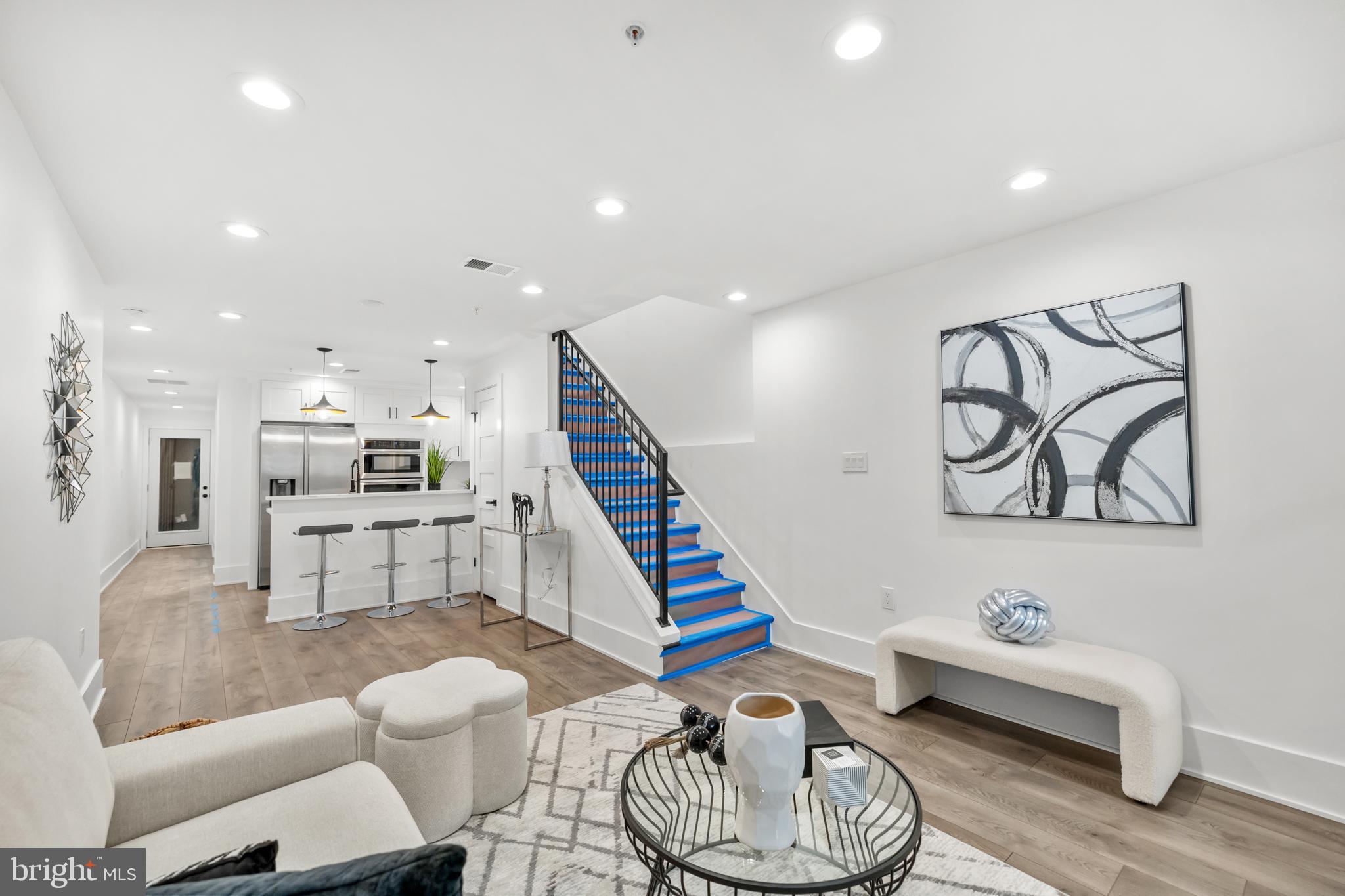 113 18th Street Southeast, Unit 1 Washington, DC 20003 - Photo 2 of 37 a living room with furniture and kitchen view