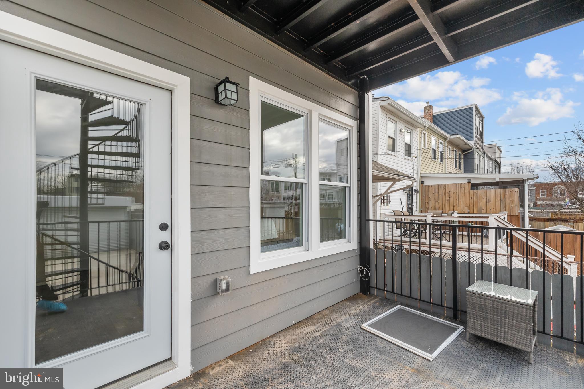 113 18th Street Southeast, Unit 1 Washington, DC 20003 - Photo 26 of 37 a view of porch with a chair and door