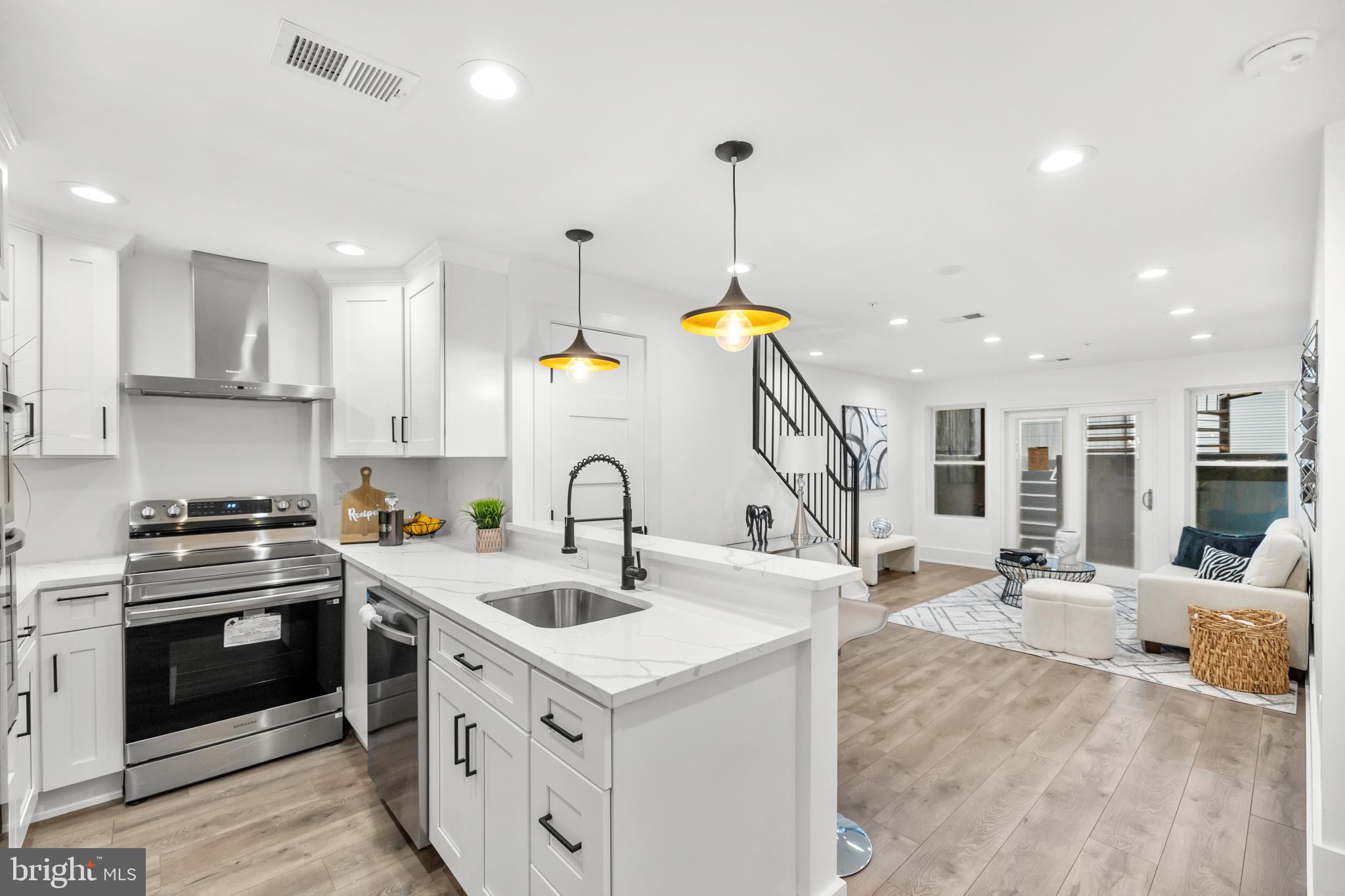 113 18th Street Southeast, Unit 1 Washington, DC 20003 - Photo 3 of 37 a kitchen with a sink stove and cabinets
