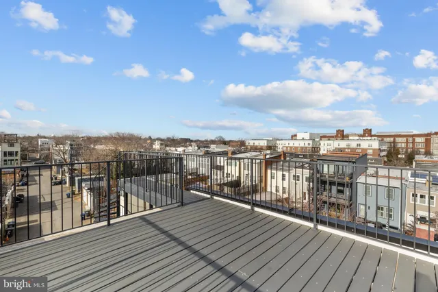 a view of a balcony with wooden floor