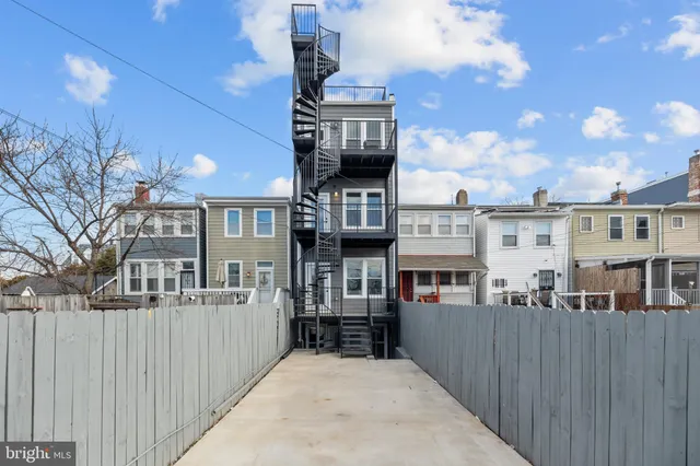 a front view of a house with large windows