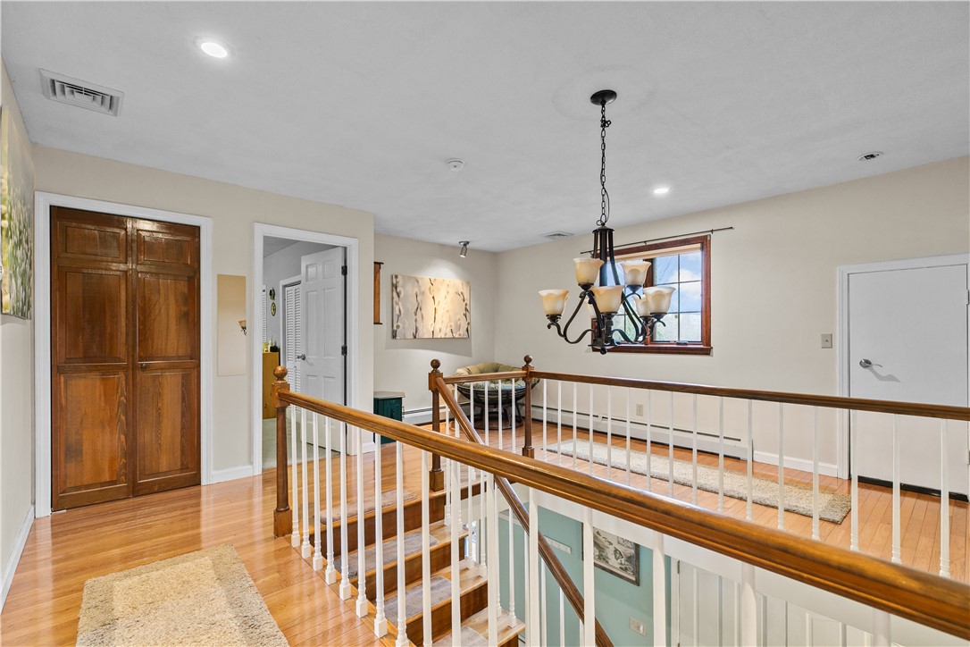 831 Crandall Road Tiverton, RI 02878 - Photo 22 of 50 Second Level Landing with view to bedrooms