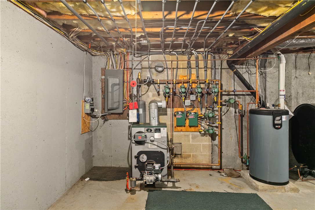 831 Crandall Road Tiverton, RI 02878 - Photo 40 of 50 Mechanicals including 200-amp panel and 6-zone boiler, hot water heater and radon mitigation system