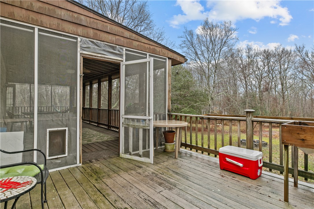 831 Crandall Road Tiverton, RI 02878 - Photo 44 of 50 View from Deck to backyard and screened porch