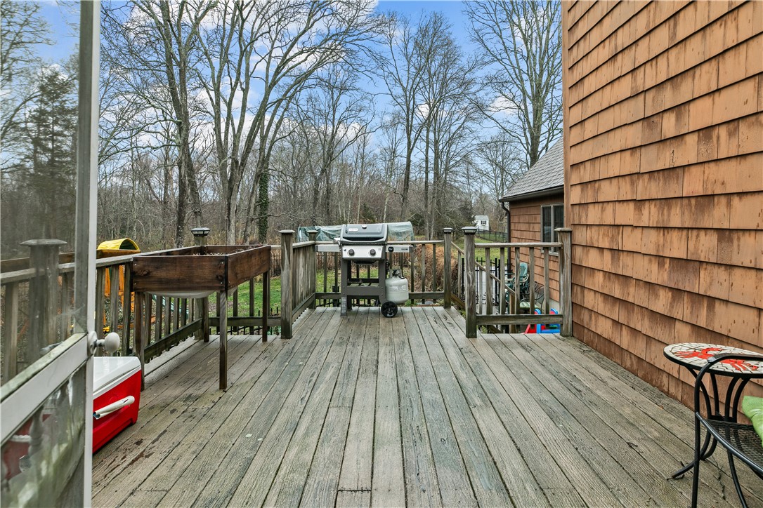 831 Crandall Road Tiverton, RI 02878 - Photo 45 of 50 Deck off back screened porch to fenced area